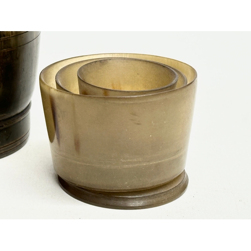 355 - Three 19th Century horn beakers. Including a later plastic collapsible beaker.