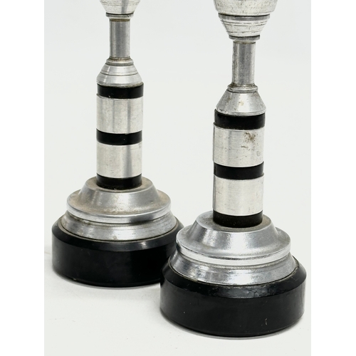 755 - A pair of candlesticks. 16cm