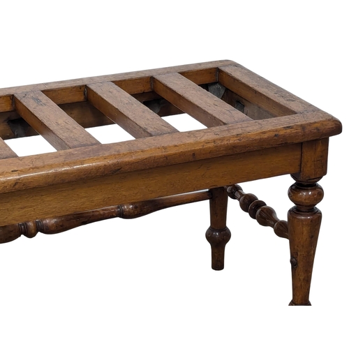 1044 - A Late 19th Century luggage rack on turned legs. 84x41x41cm(8)