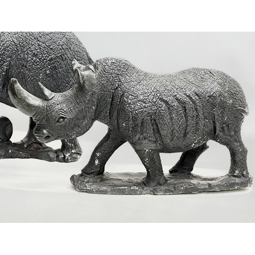 548A - 2 large stone garden figures. Elephant and Rhinoceros. 48x34cm