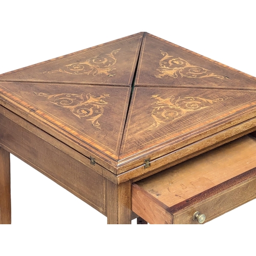 859A - A Late 19th Century Sheraton Revival inlaid mahogany envelope games table with drawer. Circa 1890s. ... 