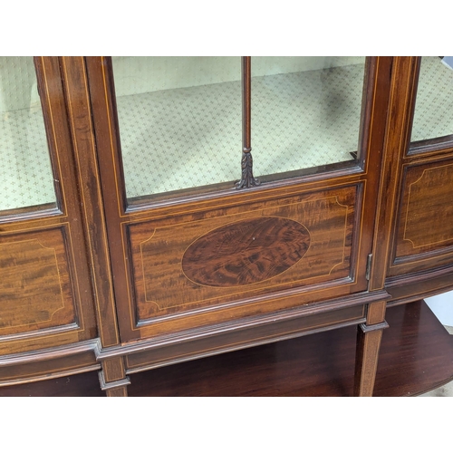 935A - A Late 19th Sheraton Revival inlaid mahogany bow front display cabinet. Circa 1890-1900. 116x41.5x19... 