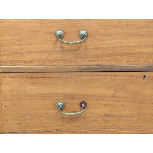 921A - A large Edwardian inlaid mahogany chest of drawers with gallery back. Circa 1910. 121x57x127cm. 1