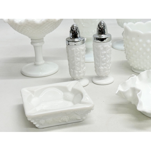 69 - A collection of Early and Mid 20th Century milk glass. Including Fenton and Westmoreland. Compotes, ... 