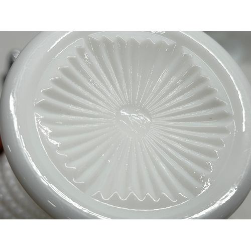 69 - A collection of Early and Mid 20th Century milk glass. Including Fenton and Westmoreland. Compotes, ... 