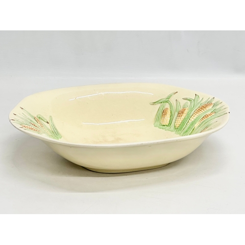 587 - A 1930’s Clarice Cliff “Corncob” bowl by Newport Pottery & Co. 29x23.5x6cm