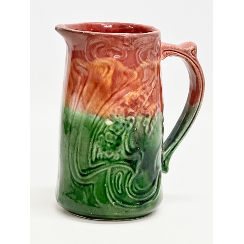 589 - A Late 19th Century Art Nouveau Majolica jug. English. 15x17.5cm