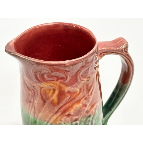 589 - A Late 19th Century Art Nouveau Majolica jug. English. 15x17.5cm