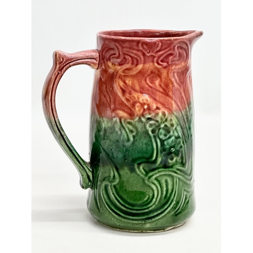 589 - A Late 19th Century Art Nouveau Majolica jug. English. 15x17.5cm