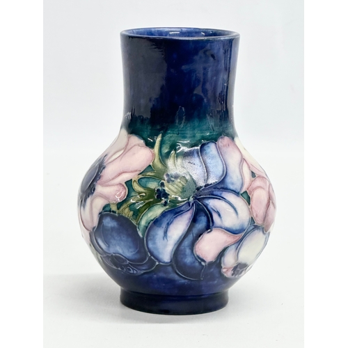 137 - A Moorcroft Pottery “Anemone” vase. 12.5cm.