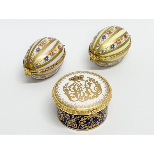 521 - Dubarry, Limoges. Two hand painted porcelain egg shaped trinket boxes, Dubarry Limoges, France. Incl... 