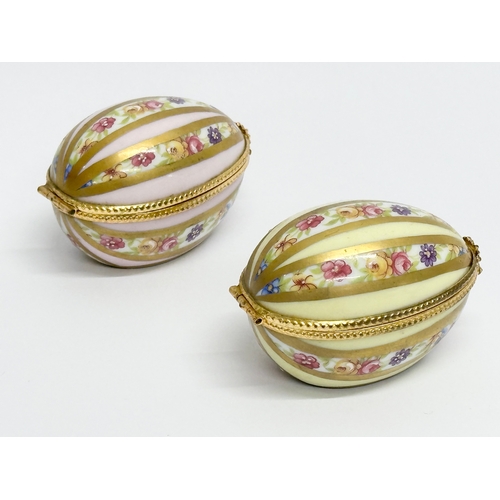 521 - Dubarry, Limoges. Two hand painted porcelain egg shaped trinket boxes, Dubarry Limoges, France. Incl... 