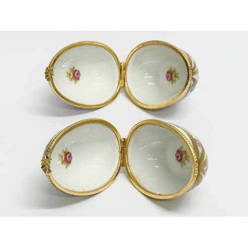 521 - Dubarry, Limoges. Two hand painted porcelain egg shaped trinket boxes, Dubarry Limoges, France. Incl... 