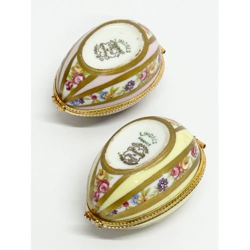 521 - Dubarry, Limoges. Two hand painted porcelain egg shaped trinket boxes, Dubarry Limoges, France. Incl... 