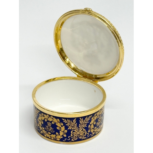 521 - Dubarry, Limoges. Two hand painted porcelain egg shaped trinket boxes, Dubarry Limoges, France. Incl... 