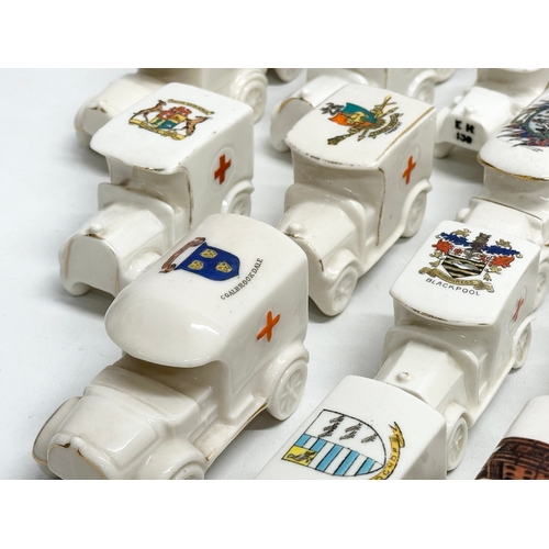 519 - A collection of 37 Early 20th Century crested china WW1 trucks. Arcadian, Carlton China, Warwick, Wi... 