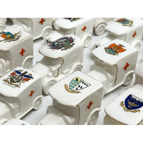 519 - A collection of 37 Early 20th Century crested china WW1 trucks. Arcadian, Carlton China, Warwick, Wi... 