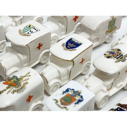 519 - A collection of 37 Early 20th Century crested china WW1 trucks. Arcadian, Carlton China, Warwick, Wi... 