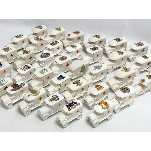 519 - A collection of 37 Early 20th Century crested china WW1 trucks. Arcadian, Carlton China, Warwick, Wi... 