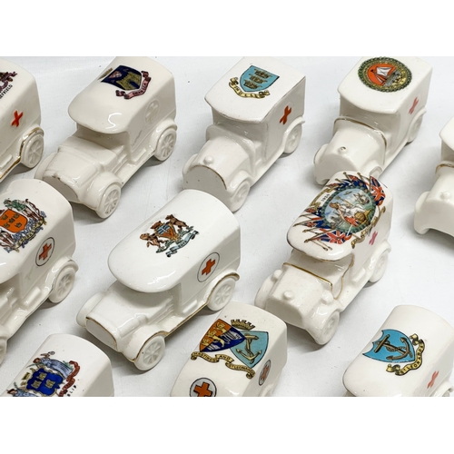 516 - A collection of 28 Early 20th Century crested china WWI trucks. Arcadian, Carlton China, Willow Art,... 