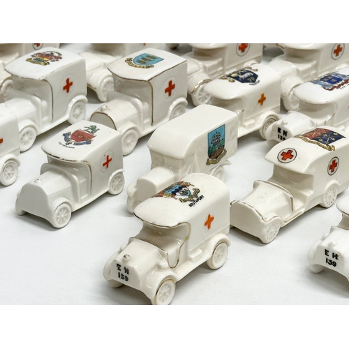 516 - A collection of 28 Early 20th Century crested china WWI trucks. Arcadian, Carlton China, Willow Art,... 