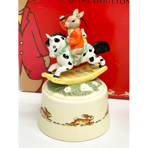 858 - Royal Doulton Bunnykins. Fun on the Water snow globe and Hold Tight music box. With boxes.