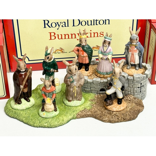 861 - Royal Doulton Bunnykins “The Robin Hood Collection” 8 figurines and base. All with boxes