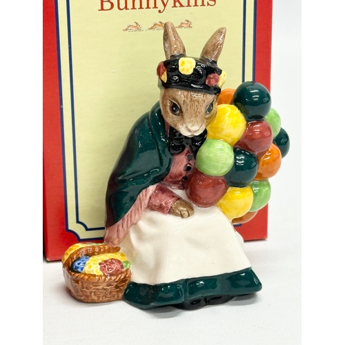 870 - Royal Doulton Bunnykins. Two Royal Doulton Bunnykins “Balloon Man” figurines. A Royal Doulton Bunnyk... 