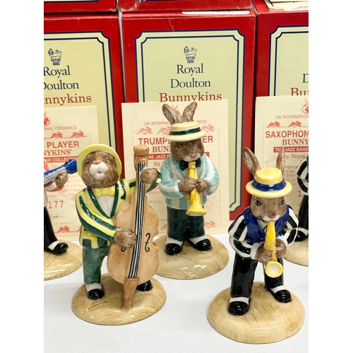 890 - 11 Royal Doulton Bunnykins The Jazz Band Collection, together with a Royal Doulton Rock and Roll Bun... 