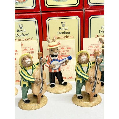 890 - 11 Royal Doulton Bunnykins The Jazz Band Collection, together with a Royal Doulton Rock and Roll Bun... 