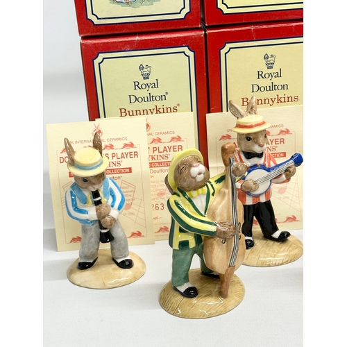 890 - 11 Royal Doulton Bunnykins The Jazz Band Collection, together with a Royal Doulton Rock and Roll Bun... 