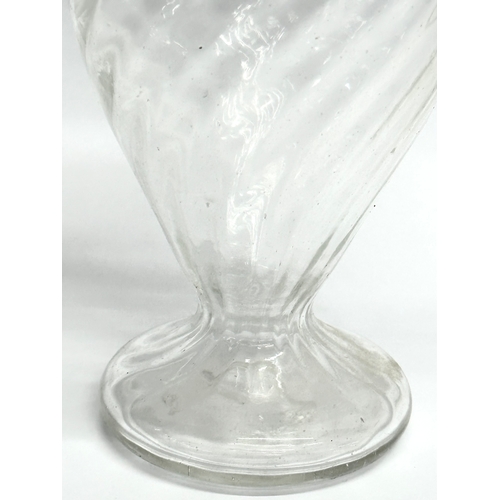 37 - A Late 18th/Early 19th Century wrythen glass vase. 14x21cm