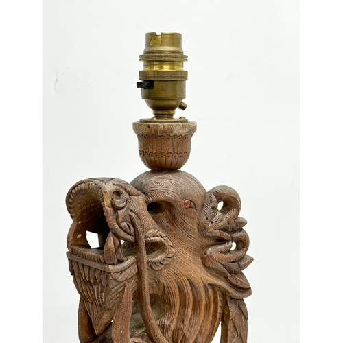 40 - A pair of Early 20th Century Chinese carved teak dragon table lamps. Circa 1920-1930. 15x14x43cm