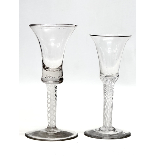 45 - Two 18th Century George III wine glasses with air twist stems. Circa 1760-1780. 17cm. 15cm