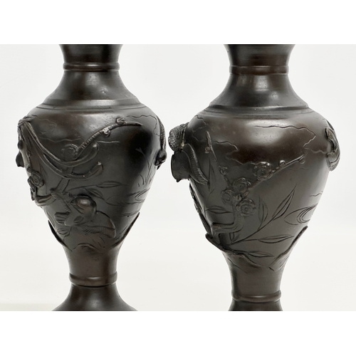 23 - Kyoto workshop. A pair of Japanese bronze Meiji Period baluster vases. Birds in flight and lotus lea... 