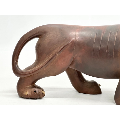 86 - An Early 20th Century carved boxwood lion and pray. 28x15cm