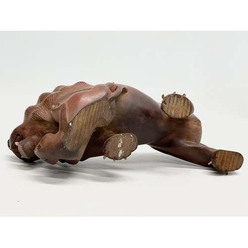 86 - An Early 20th Century carved boxwood lion and pray. 28x15cm