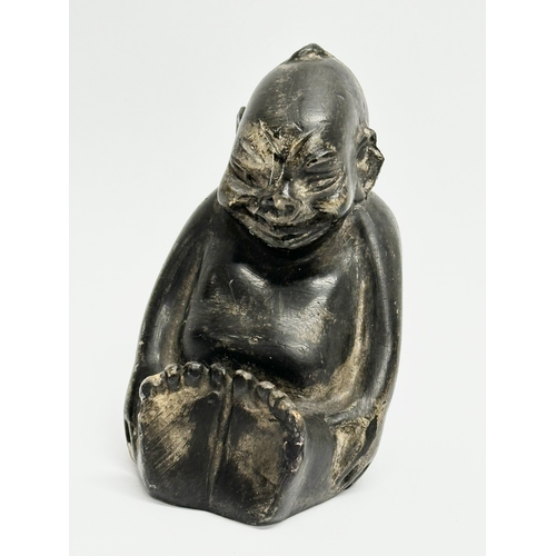 42 - An Early 20th Century carved stone Billiken. 7x6x10cm