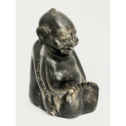 42 - An Early 20th Century carved stone Billiken. 7x6x10cm