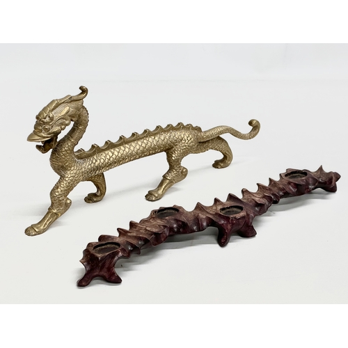 29 - A large Early/Mid 20th Century Chinese brass dragon on stand. 35x16cm