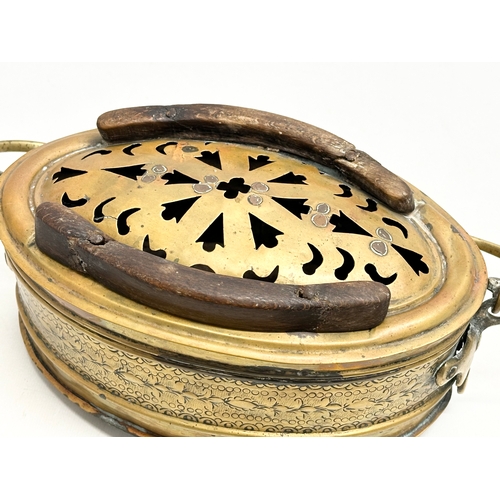 56 - A 19th Century engraved brass carriage foot warmer. 31x15cm