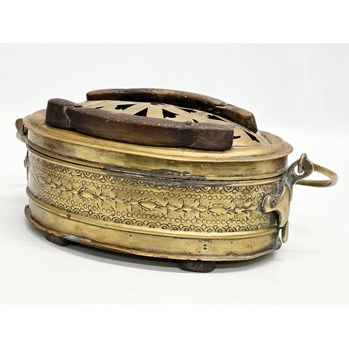 56 - A 19th Century engraved brass carriage foot warmer. 31x15cm