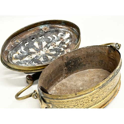 56 - A 19th Century engraved brass carriage foot warmer. 31x15cm