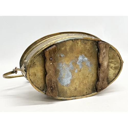 56 - A 19th Century engraved brass carriage foot warmer. 31x15cm