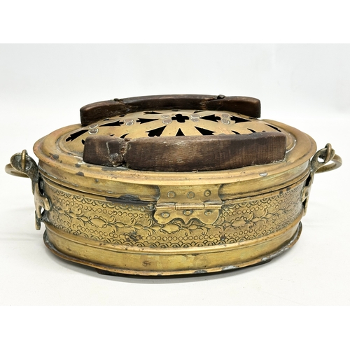 56 - A 19th Century engraved brass carriage foot warmer. 31x15cm