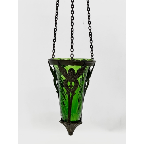 6 - A bronzed light fitting with Bristol Green glass shade. 61cm including chain.