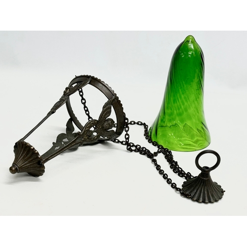 6 - A bronzed light fitting with Bristol Green glass shade. 61cm including chain.