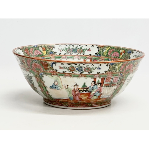 13 - A Chinese Export Rose Medallion punch bowl. Late Qing Dynasty. Emperor Guangxu. Decorated with Guang... 