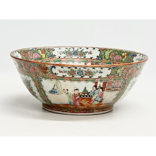 13 - A Chinese Export Rose Medallion punch bowl. Late Qing Dynasty. Emperor Guangxu. Decorated with Guang... 