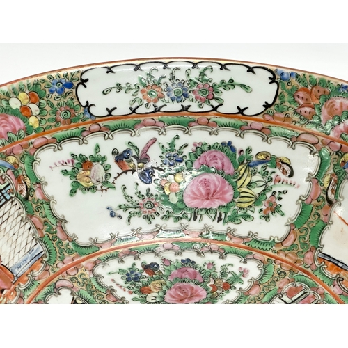 13 - A Chinese Export Rose Medallion punch bowl. Late Qing Dynasty. Emperor Guangxu. Decorated with Guang... 